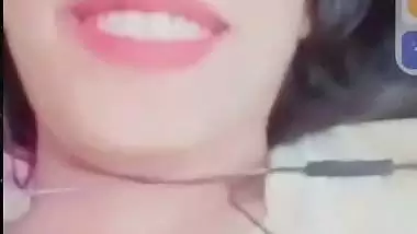 Smiling girlfriend video call to boyfriend shows boobs