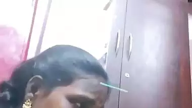 Mature tattooed Tamil wife giving handjob to husband